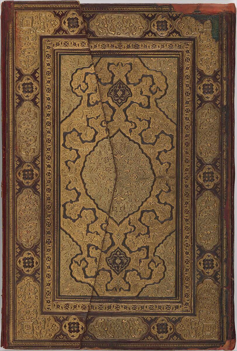 Gold floral medallion and tooled borders on an Isfahan bookbinding